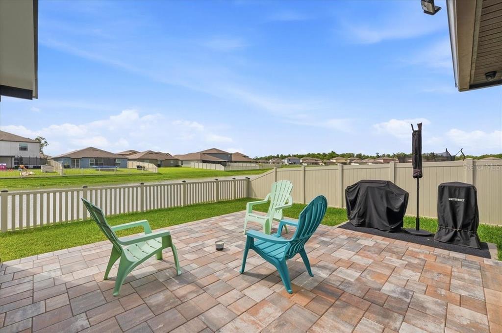 1923 Red Loop Lakeland, FL 33801 - Photo 40 of 51 a view of a lake with a chair and table in the patio