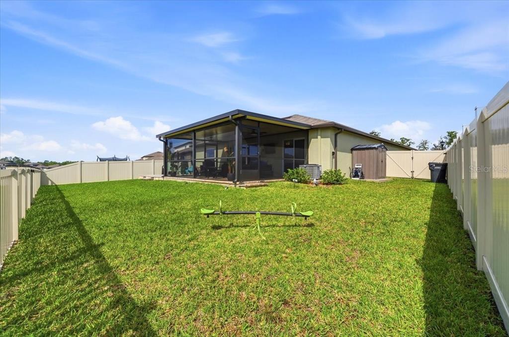 1923 Red Loop Lakeland, FL 33801 - Photo 4 of 51 a view of a house with a big yard