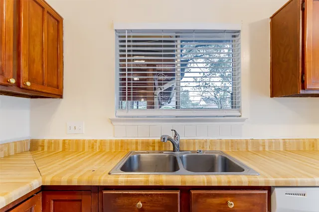a view of a sink and a window