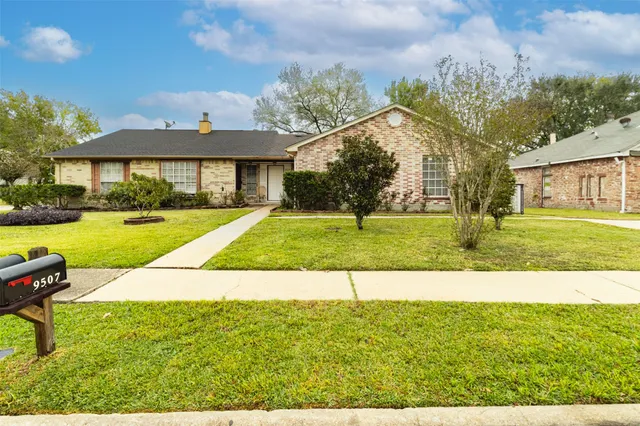 a house view with a garden space