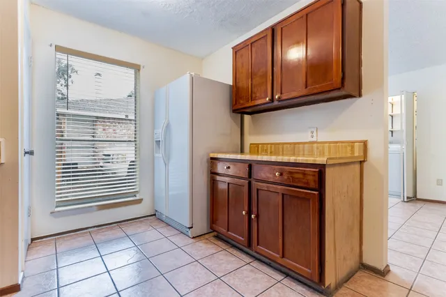 a view of a kitchen with electric appliances
