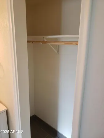 a bathroom with a shower and a sink