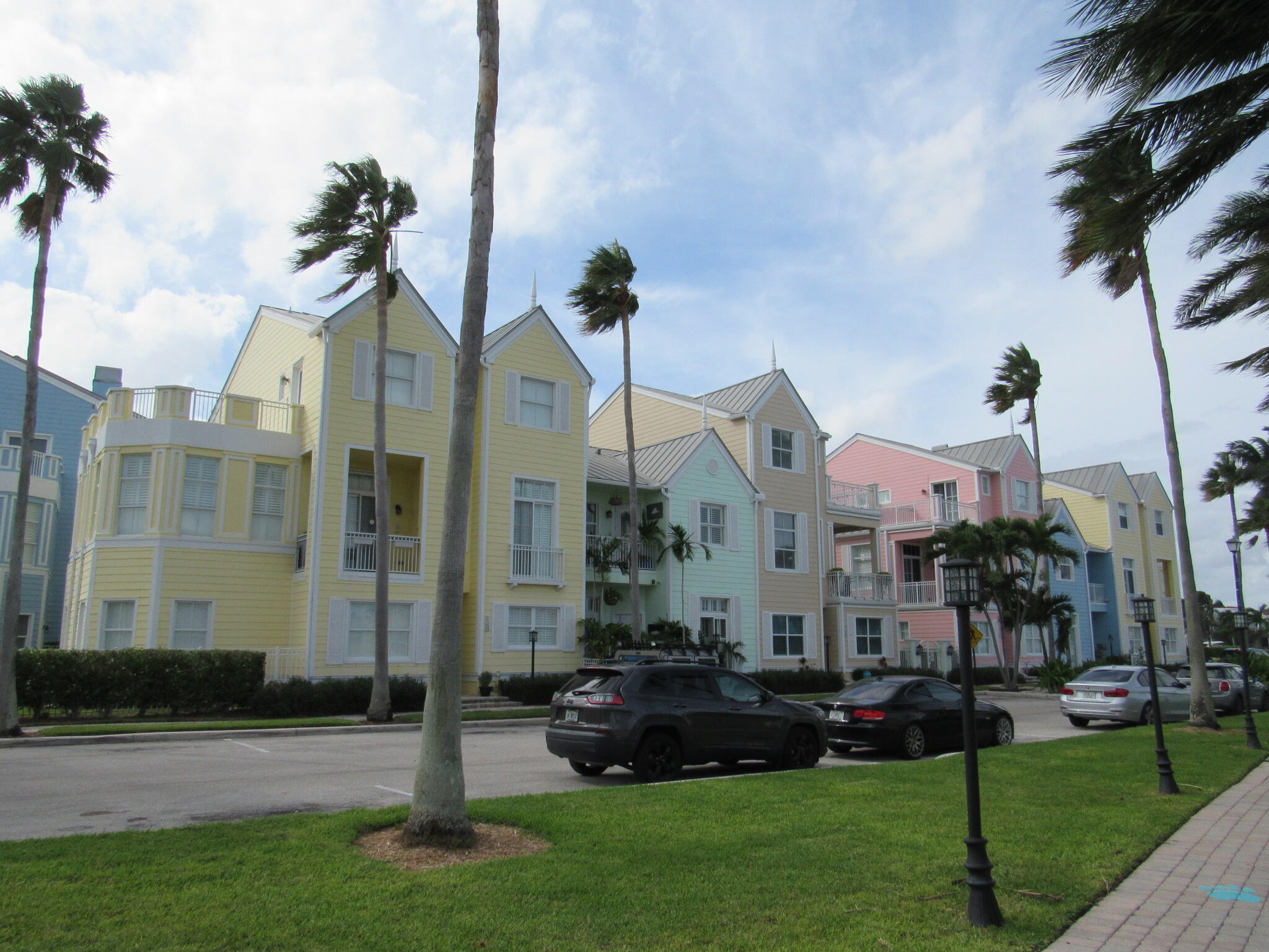 1911 Northeast 27th Court, Unit 13 Lighthouse Point, FL 33064 - Photo 45 of 61 a front view of a house with a garden