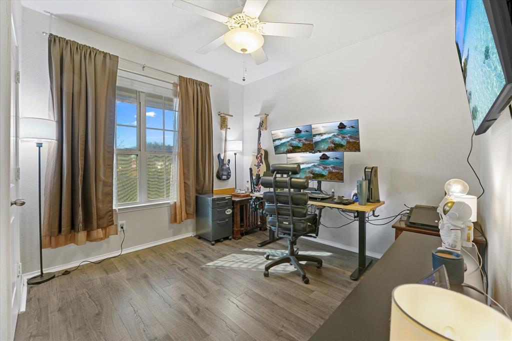 3801 Surf Street Denton, TX 76208 - Photo 14 of 29 Home office featuring light wood finished floors and ceiling fan
