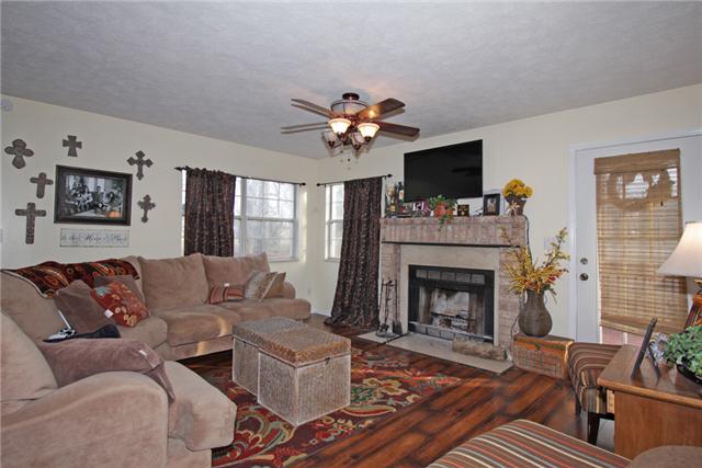 3330 Ott Wilson Road Springfield, TN 37172 - Photo 3 of 17 a living room with furniture and a fireplace