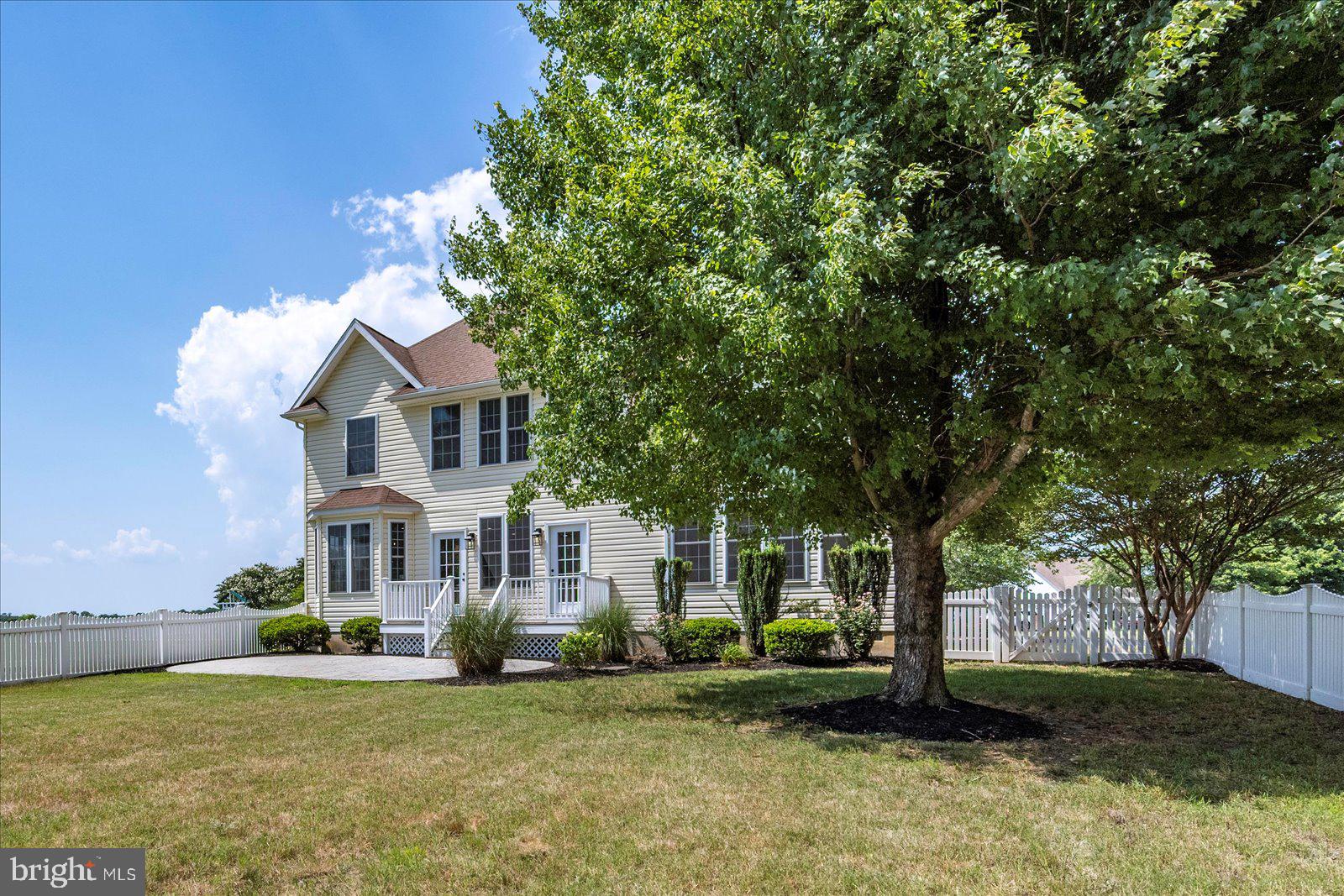 26161 Bosch Lane Hebron, MD 21830 - Photo 2 of 49 a front view of a house with a garden