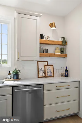 a bathroom with double vanity and a mirror