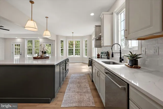 a view of a hallway with chandelier