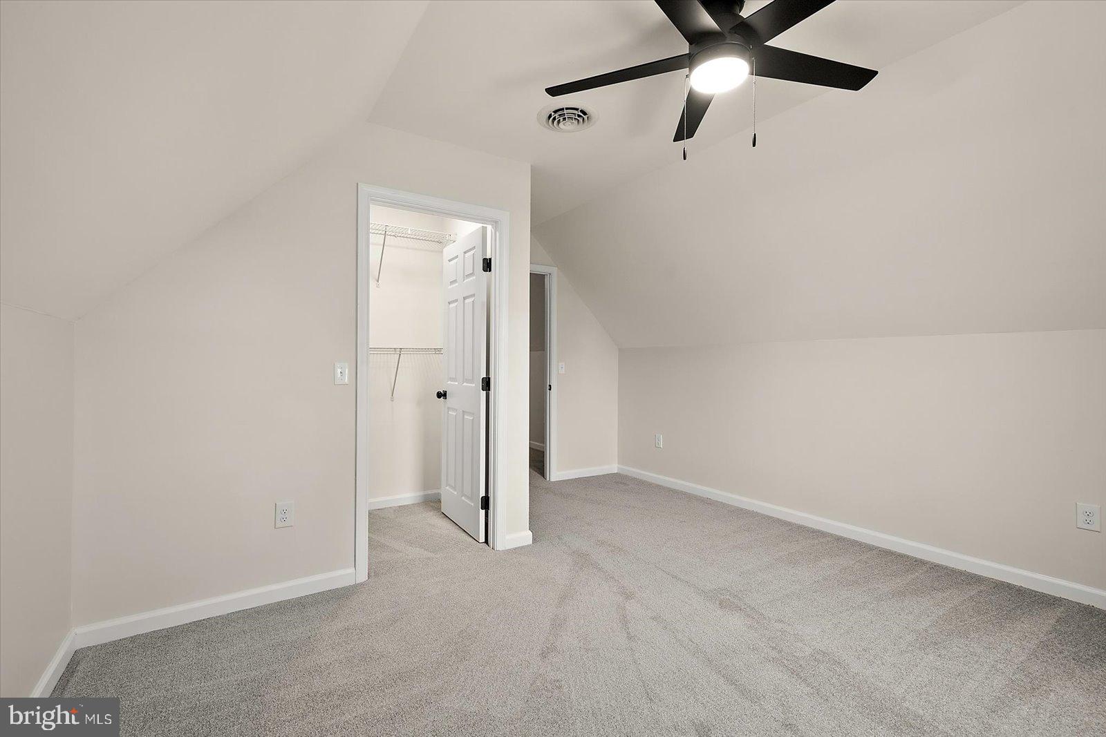 26161 Bosch Lane Hebron, MD 21830 - Photo 31 of 49 an empty room with closet and a chandelier fan