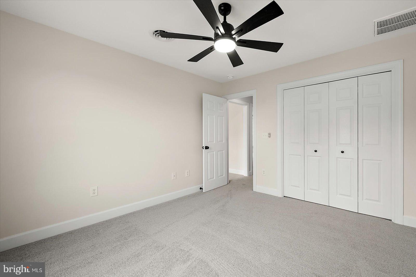 26161 Bosch Lane Hebron, MD 21830 - Photo 33 of 49 an empty room with a ceiling fan