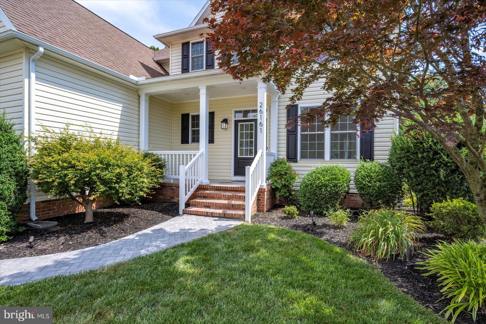 26161 Bosch Lane Hebron, MD 21830 - Photo 44 of 49 a front view of a house with yard and green space