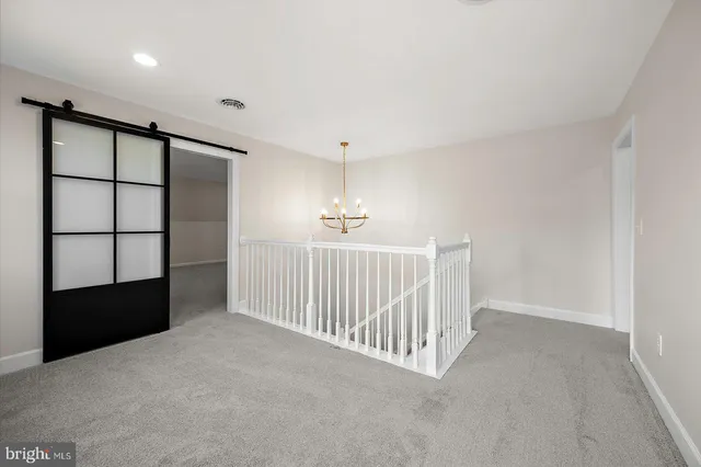 a front view of a house with yard and green space