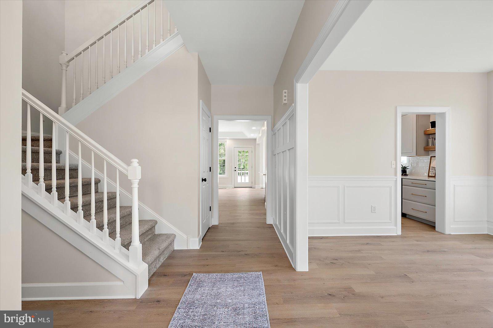 26161 Bosch Lane Hebron, MD 21830 - Photo 10 of 49 a view of a hallway with wooden floor and entryway