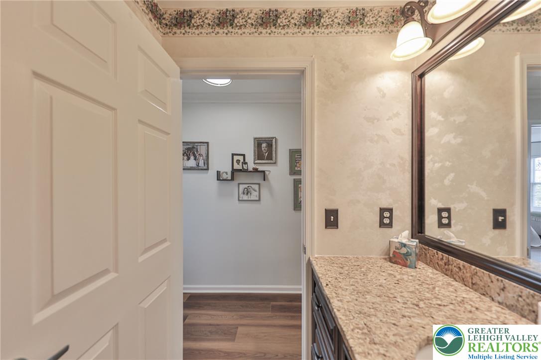 163 Muirfield Way Easton, PA 18042 - Photo 33 of 48 a bathroom with a granite countertop sink and a mirror