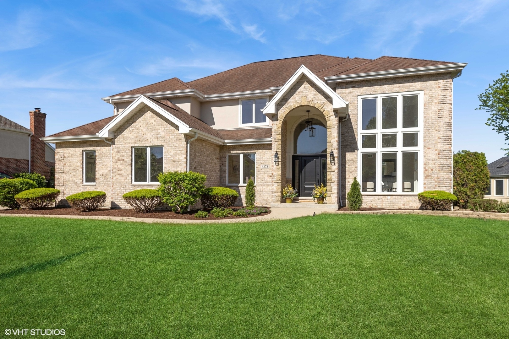 6878 Fieldstone Drive Burr Ridge, IL 60527 - Photo 1 of 45 a front view of a house with a yard