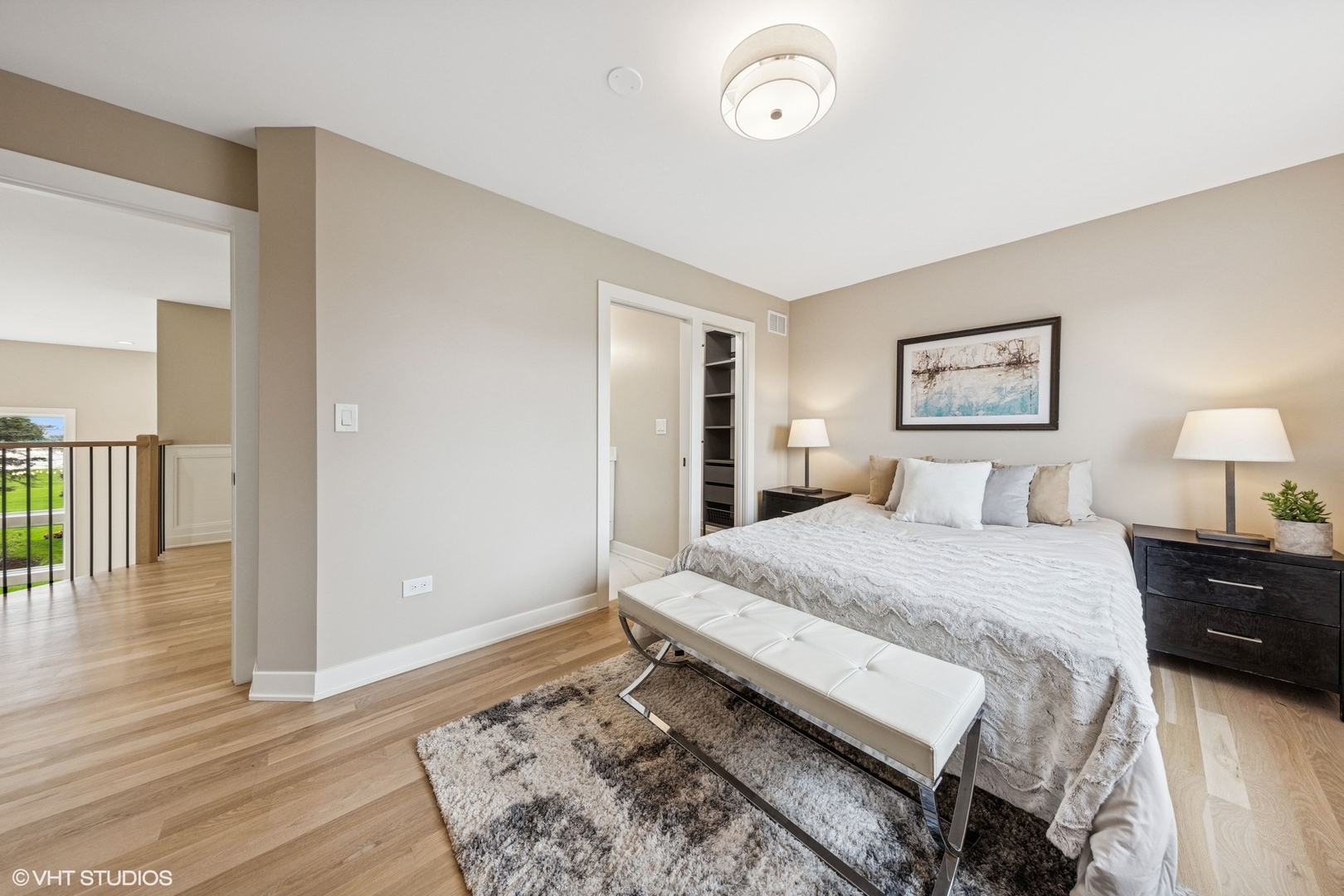 6878 Fieldstone Drive Burr Ridge, IL 60527 - Photo 28 of 45 a spacious bedroom with a bed and wooden floor