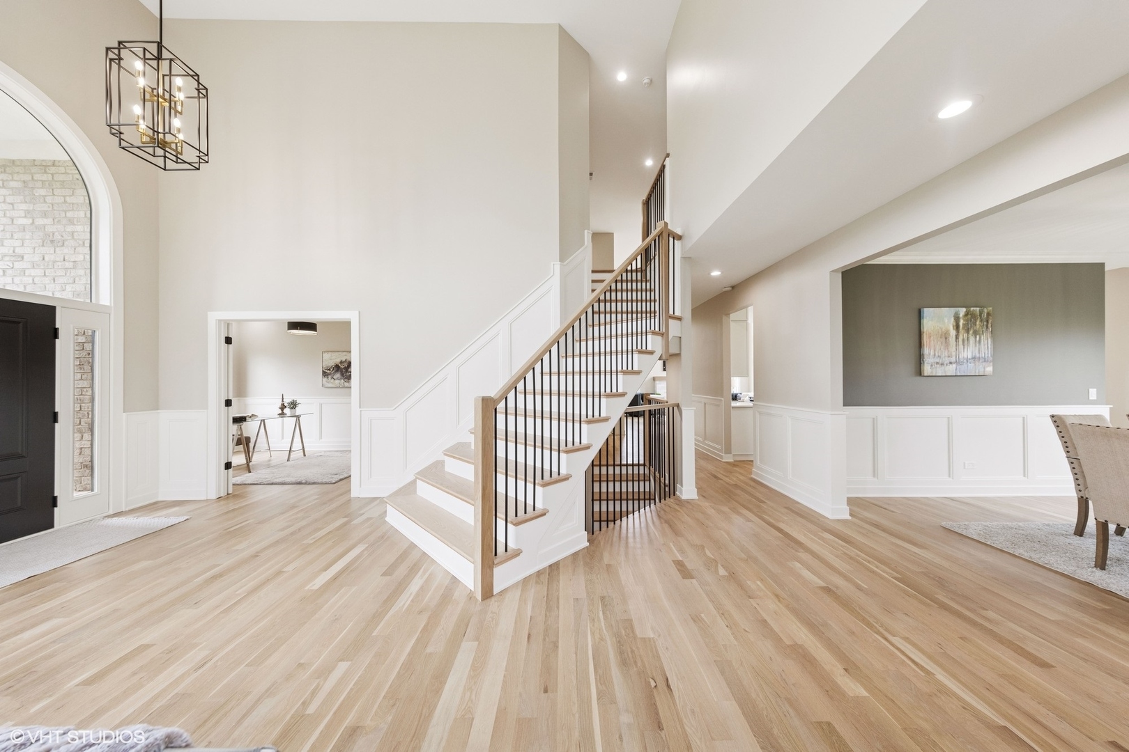 6878 Fieldstone Drive Burr Ridge, IL 60527 - Photo 3 of 45 a view of a livingroom with wooden floor and stairs