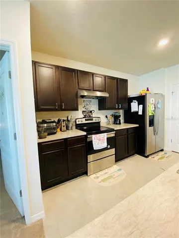a outdoor space with furniture a window and a projector