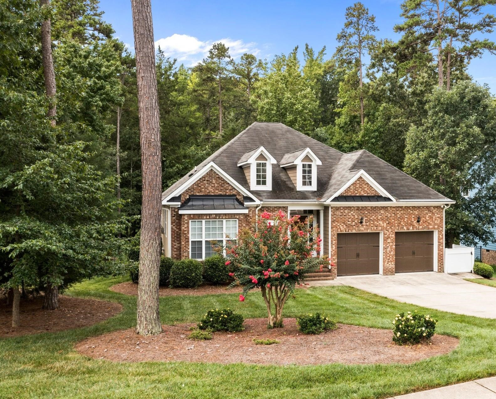104 Harkness Circle Durham, NC 27705 - Photo 1 of 23 a front view of a house with a yard