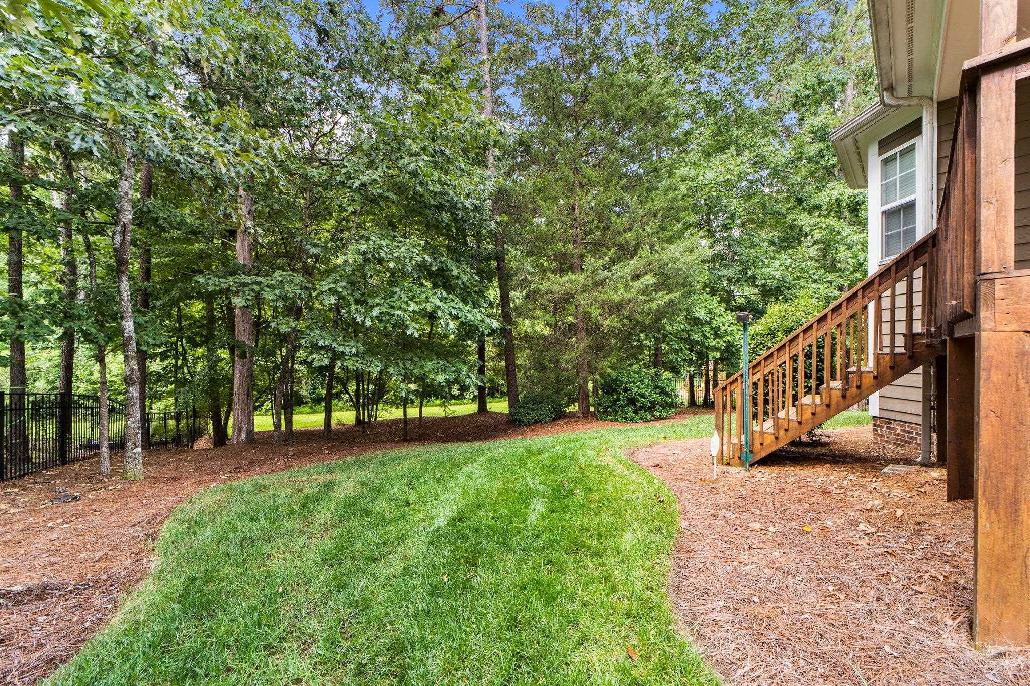 104 Harkness Circle Durham, NC 27705 - Photo 19 of 23 a view of yard with grass and a trees