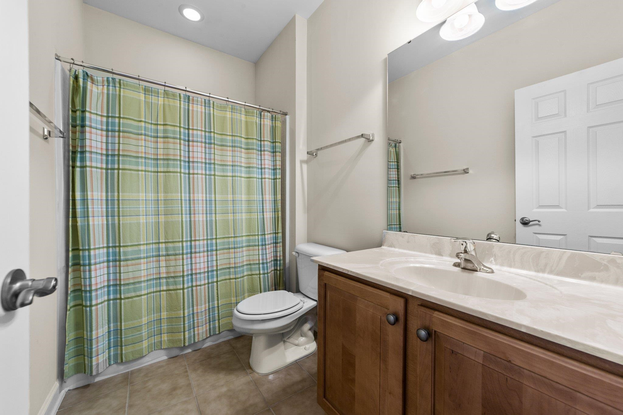 104 Harkness Circle Durham, NC 27705 - Photo 4 of 23 a bathroom with a sink toilet and shower