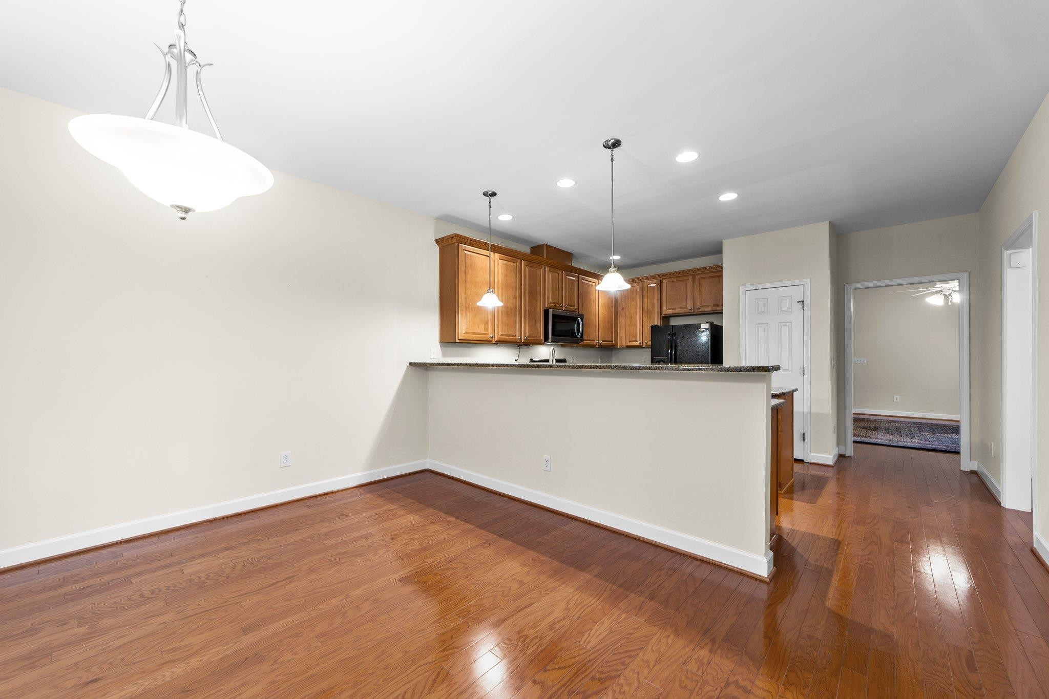 104 Harkness Circle Durham, NC 27705 - Photo 10 of 23 a view of kitchen with cabinets and wooden floor