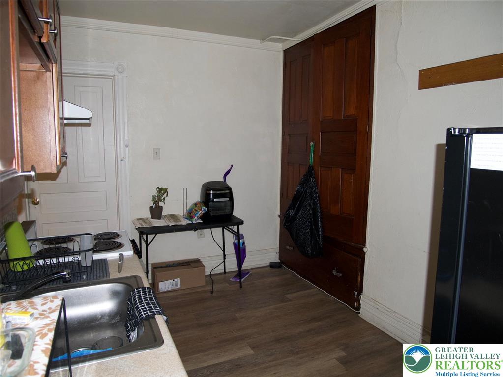 518 Tilghman Street, Unit 3 Allentown, PA 18102 - Photo 5 of 14 a room with furniture and a gate