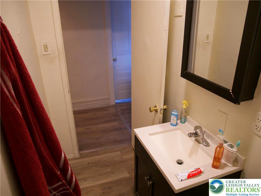 518 Tilghman Street, Unit 3 Allentown, PA 18102 - Photo 7 of 14 a bathroom with a sink and a mirror