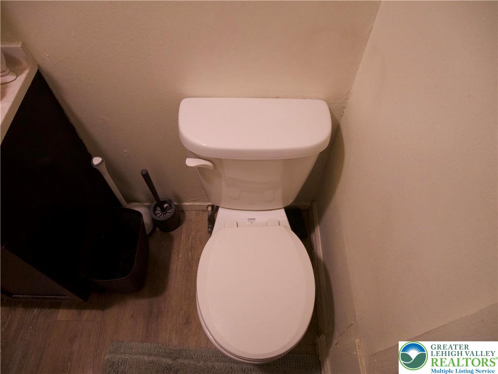 518 Tilghman Street, Unit 3 Allentown, PA 18102 - Photo 8 of 14 a bathroom with a toilet and a mirror