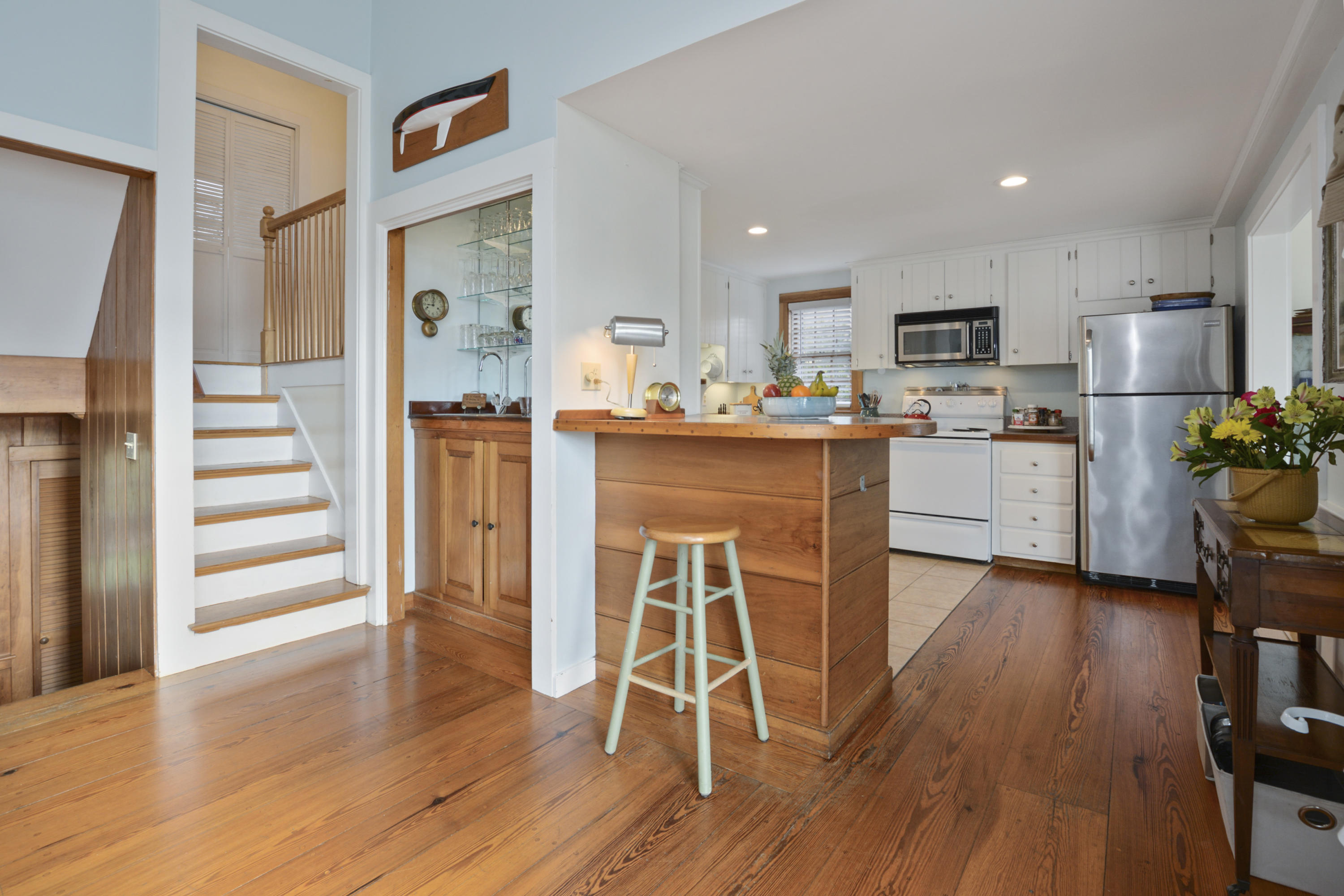 18 Peaks Drive Osterville, MA 02655 - Photo 13 of 40 a kitchen with a wooden floor and stainless steel appliances