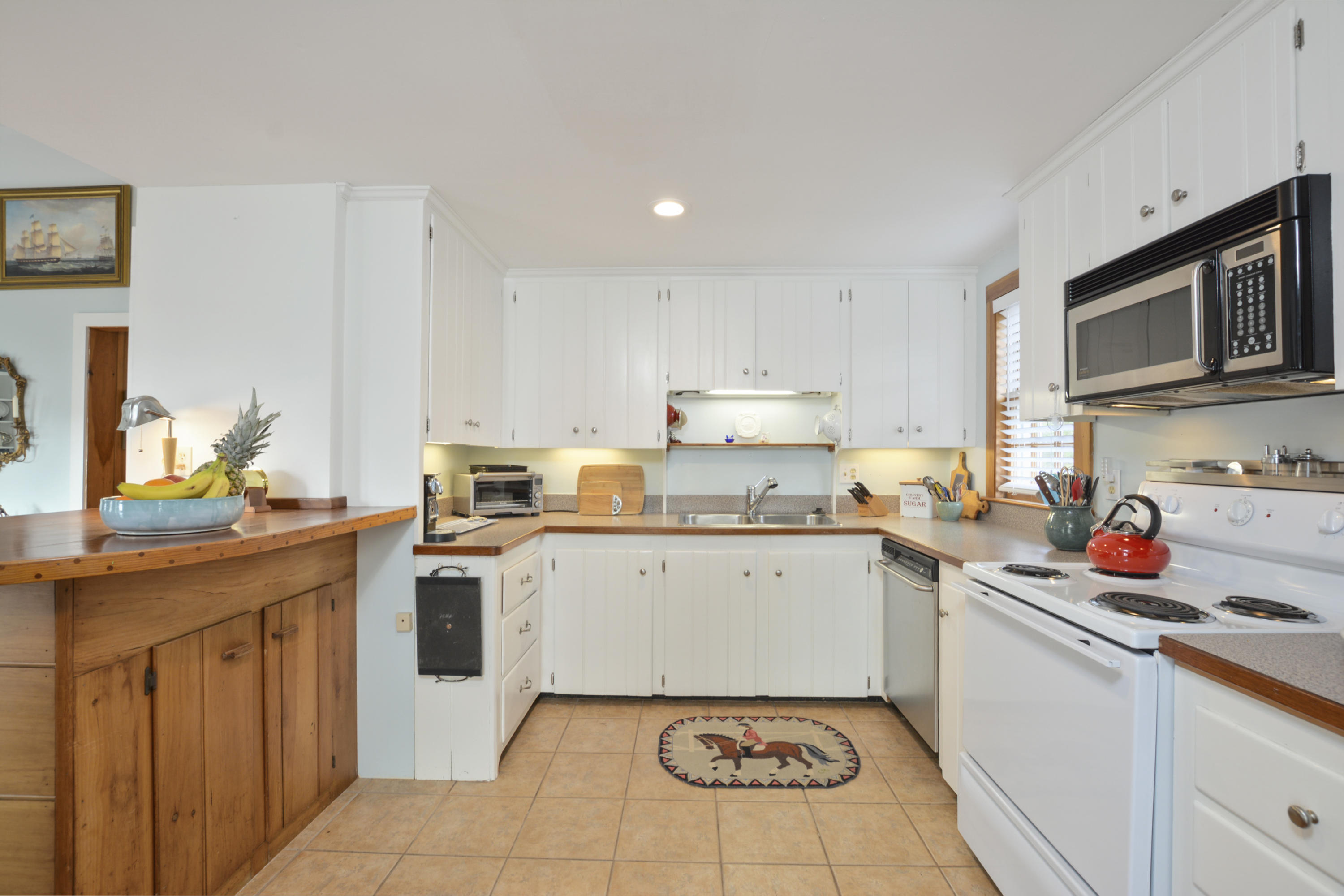 18 Peaks Drive Osterville, MA 02655 - Photo 17 of 40 a kitchen with a sink stove and cabinets