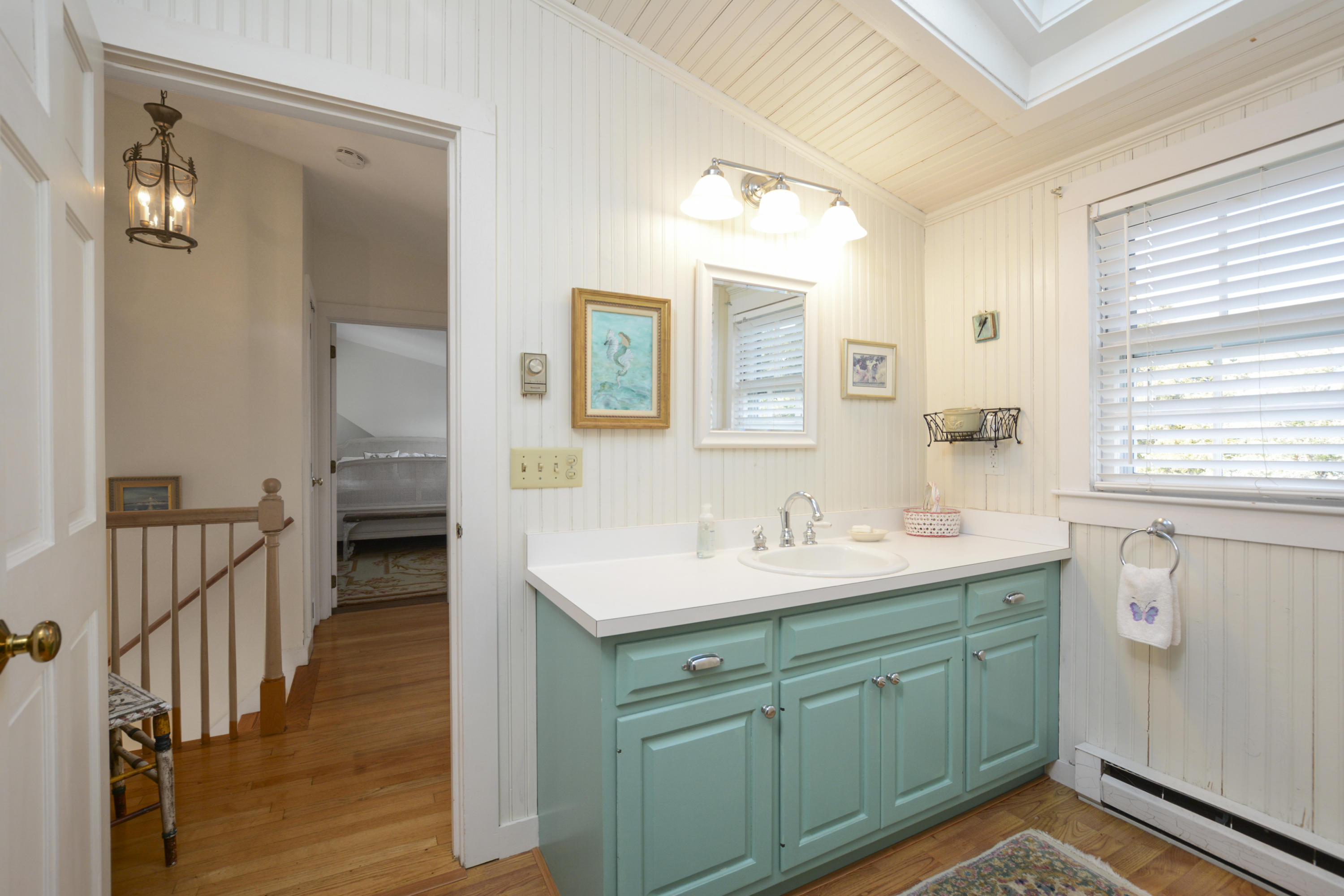 18 Peaks Drive Osterville, MA 02655 - Photo 24 of 40 a en suite bathroom with a sink mirror and a shower