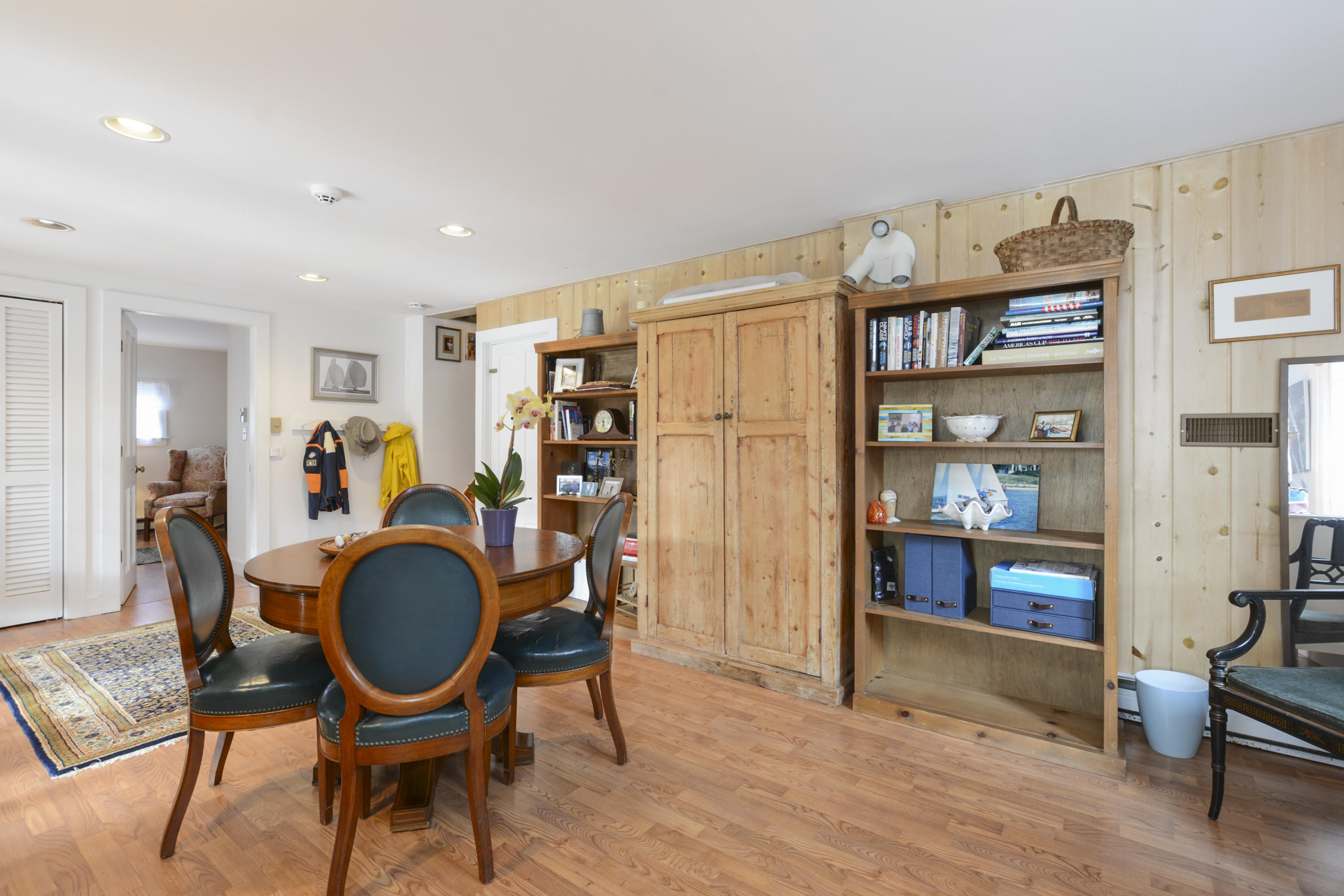 18 Peaks Drive Osterville, MA 02655 - Photo 27 of 40 a living room with furniture a rug and a book shelf