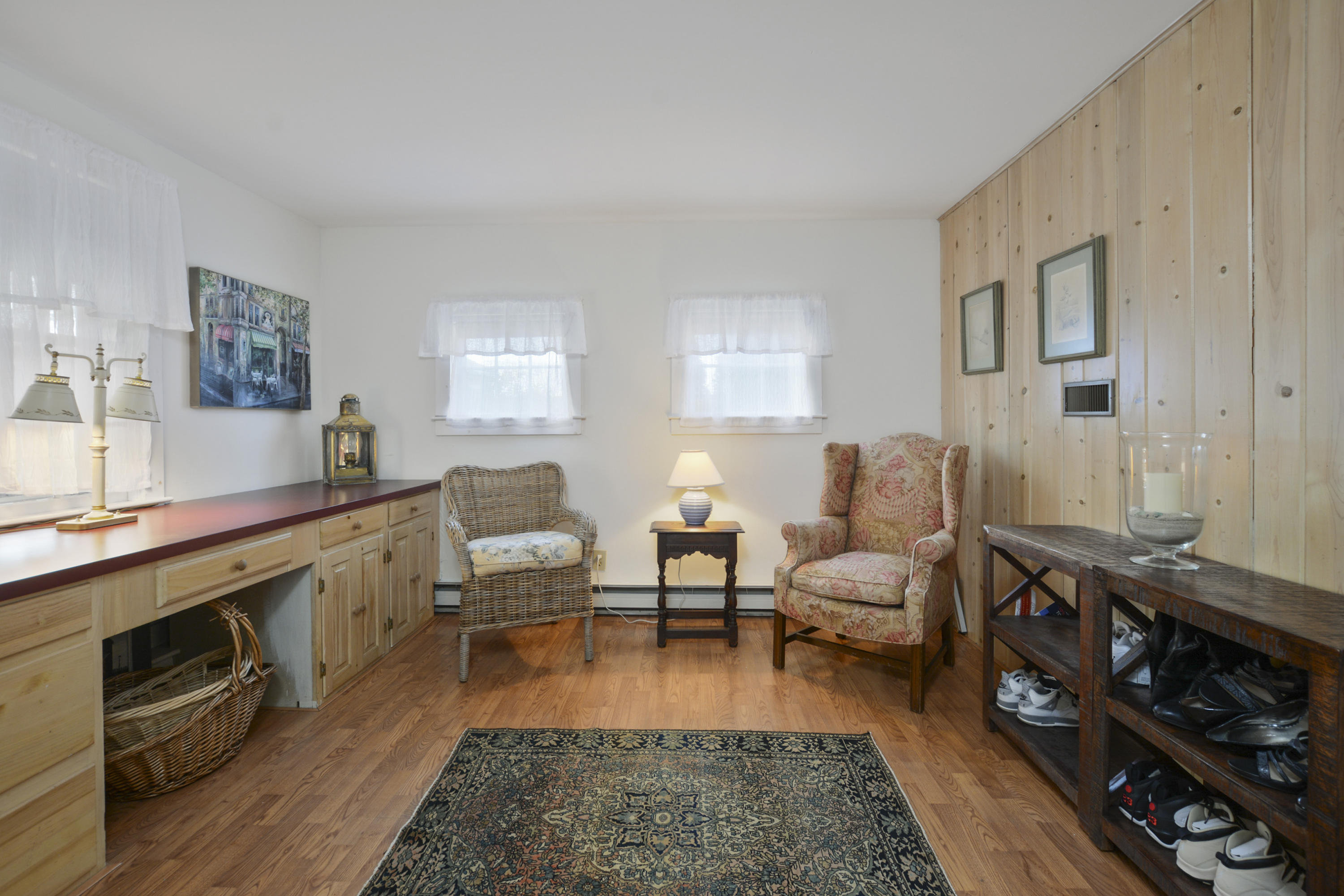 18 Peaks Drive Osterville, MA 02655 - Photo 30 of 40 a living room with stainless steel appliances furniture a rug and a fireplace