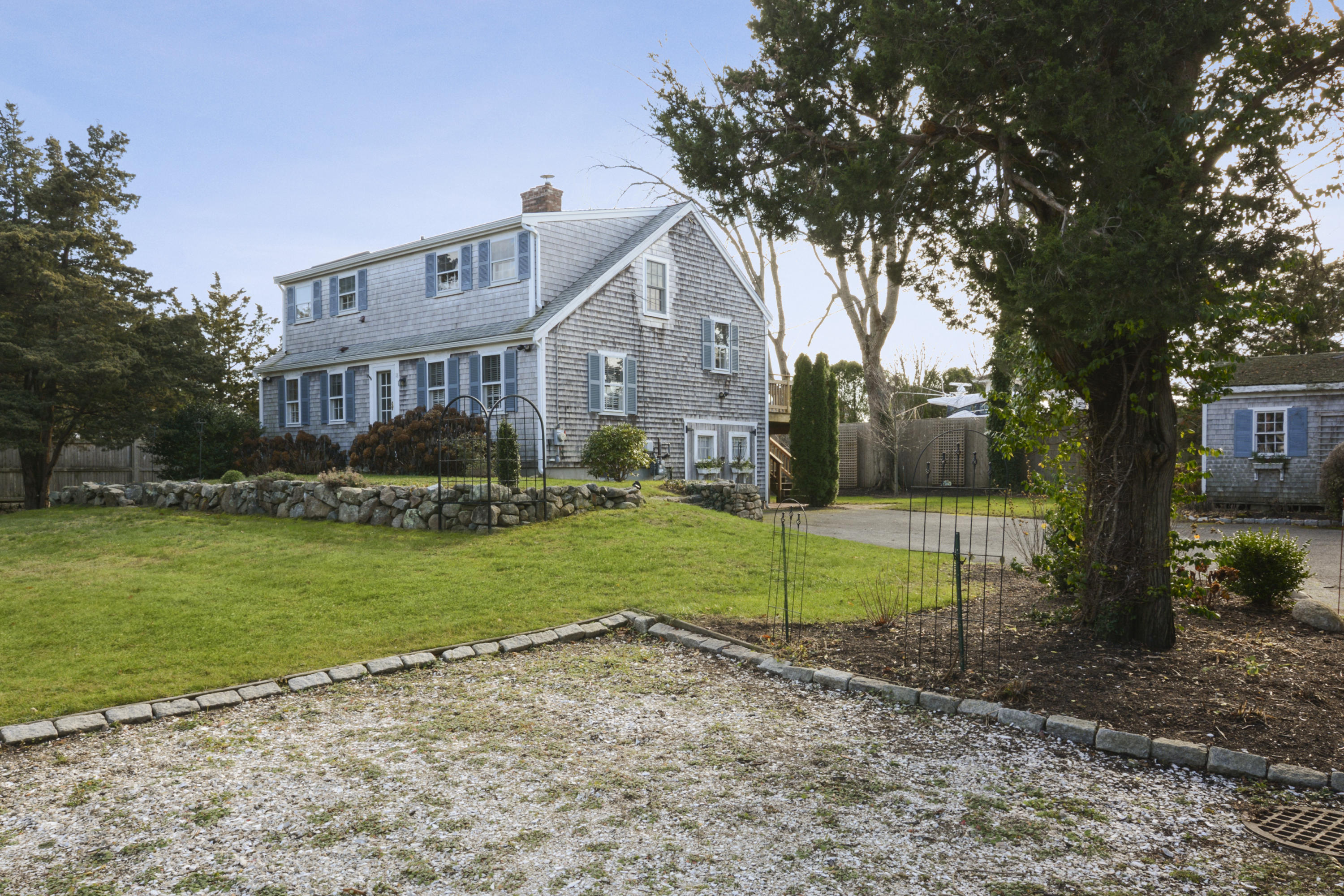 18 Peaks Drive Osterville, MA 02655 - Photo 3 of 40 a view of backyard of house with green space