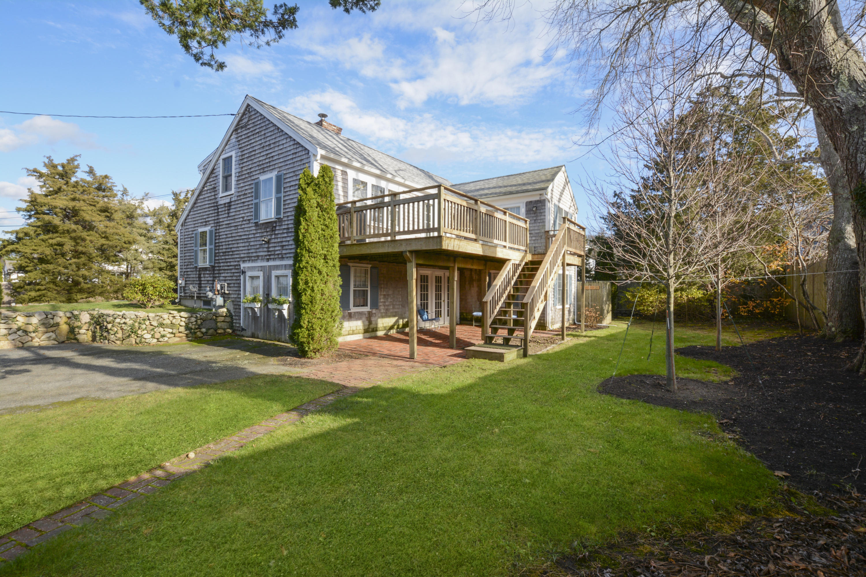18 Peaks Drive Osterville, MA 02655 - Photo 34 of 40 a view of a house with a yard porch and sitting area