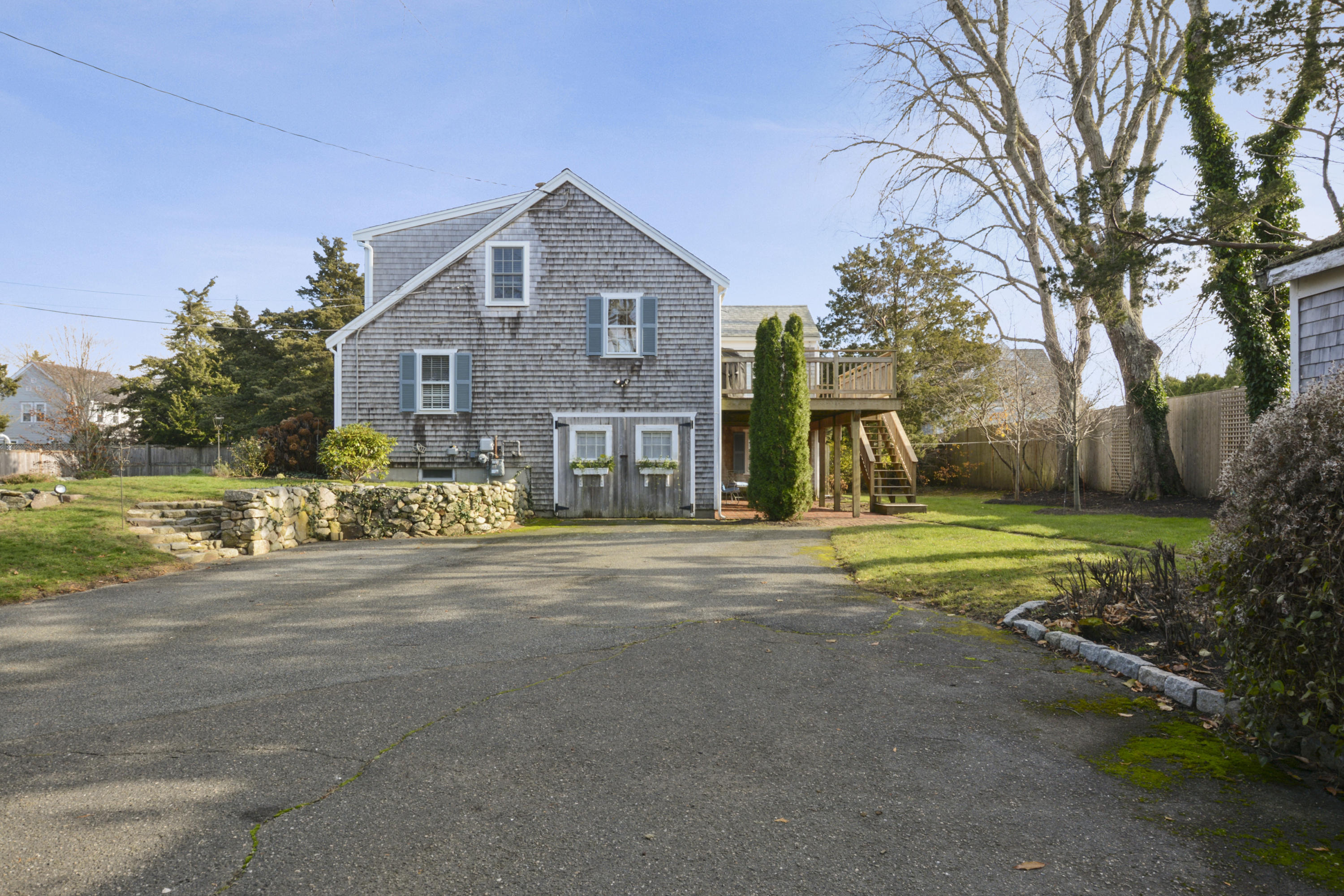 18 Peaks Drive Osterville, MA 02655 - Photo 35 of 40 a view of a house with a yard and large tree