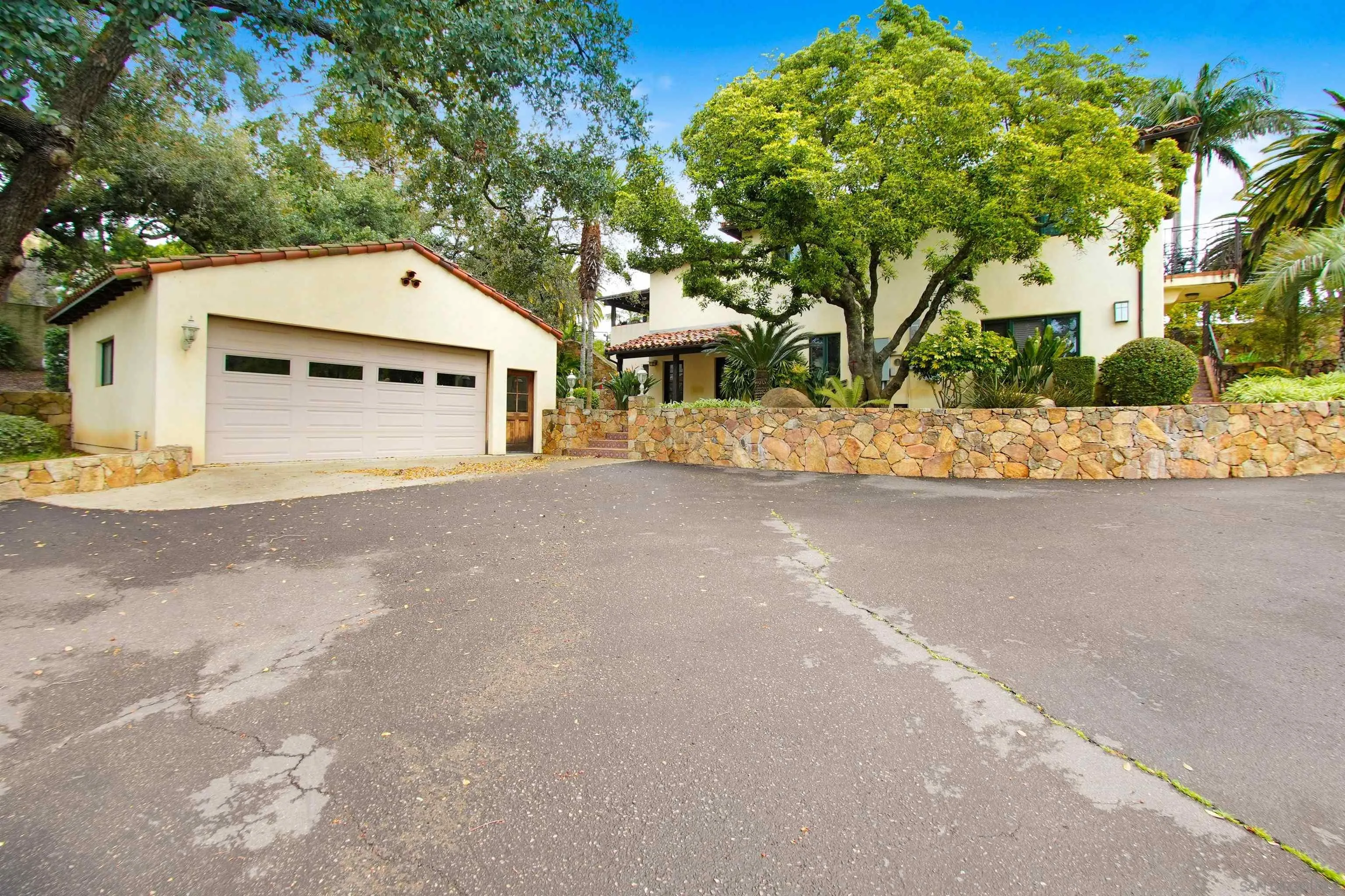 16757 Old Guejito Grade Road Escondido, CA 92027 - Photo 6 of 38 a view of a house with a yard and garage