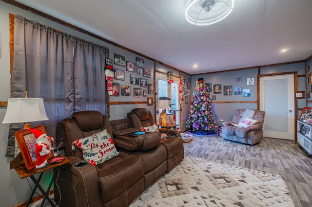 a view of a dining room with furniture and a kitchen