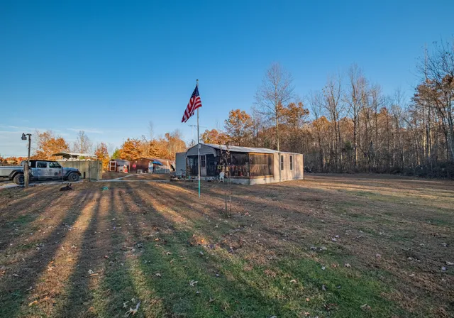 a view of a house next to a road