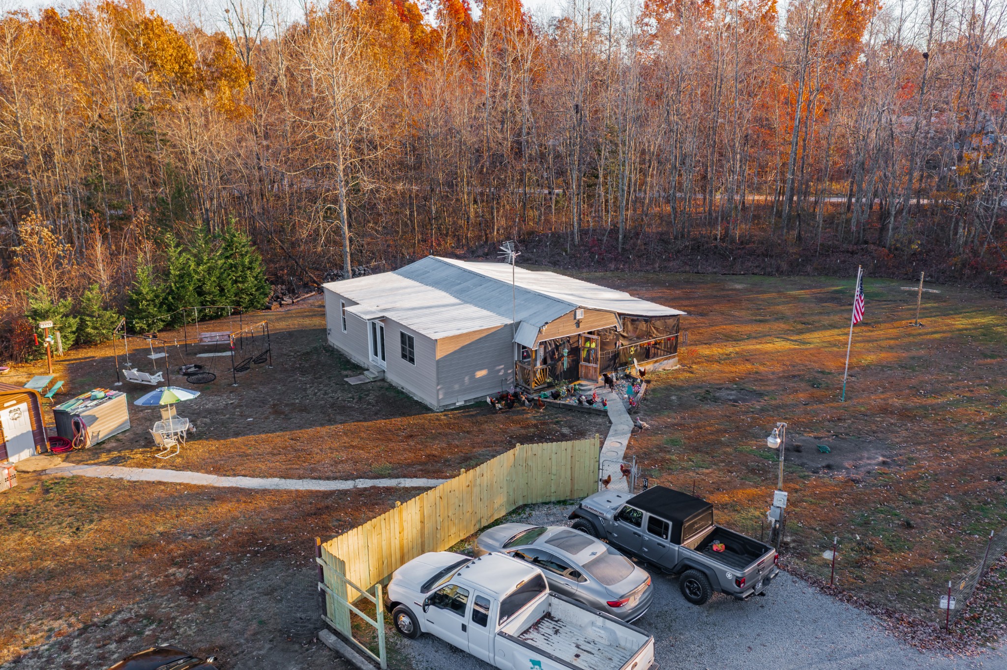 73 Spring Lake Circle Beechgrove, TN 37018 - Photo 33 of 43 a view of a backyard with chairs and a small yard