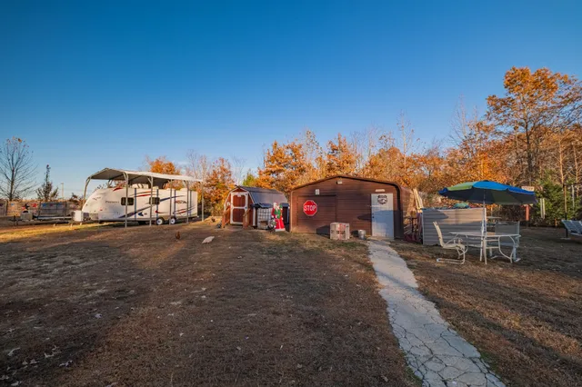 a view of a bench in a backyard