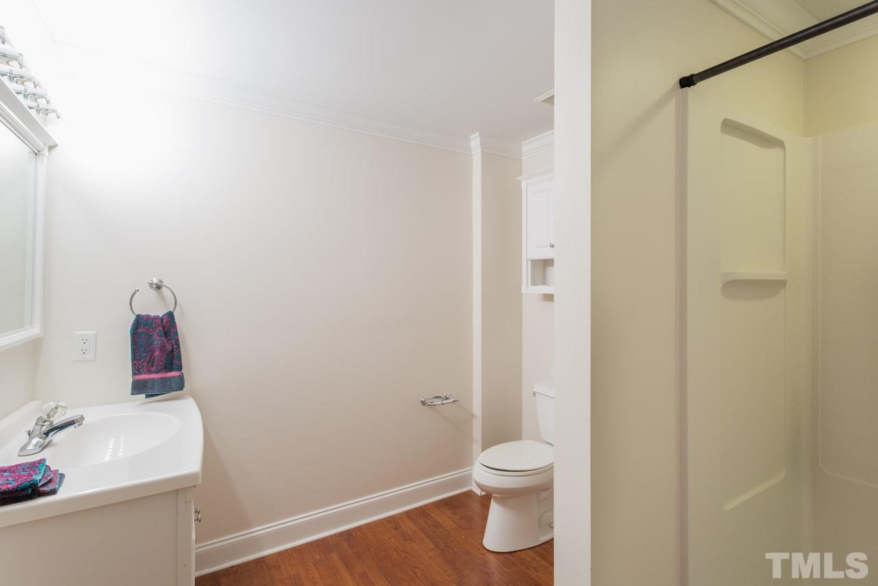 4625 Gamelyn Walk Raleigh, NC 27612 - Photo 14 of 25 a bathroom with a sink and a toilet
