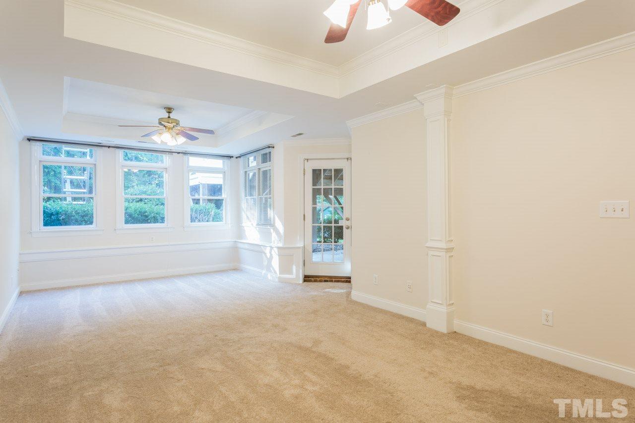 4625 Gamelyn Walk Raleigh, NC 27612 - Photo 15 of 25 an empty room with windows and chandelier fan