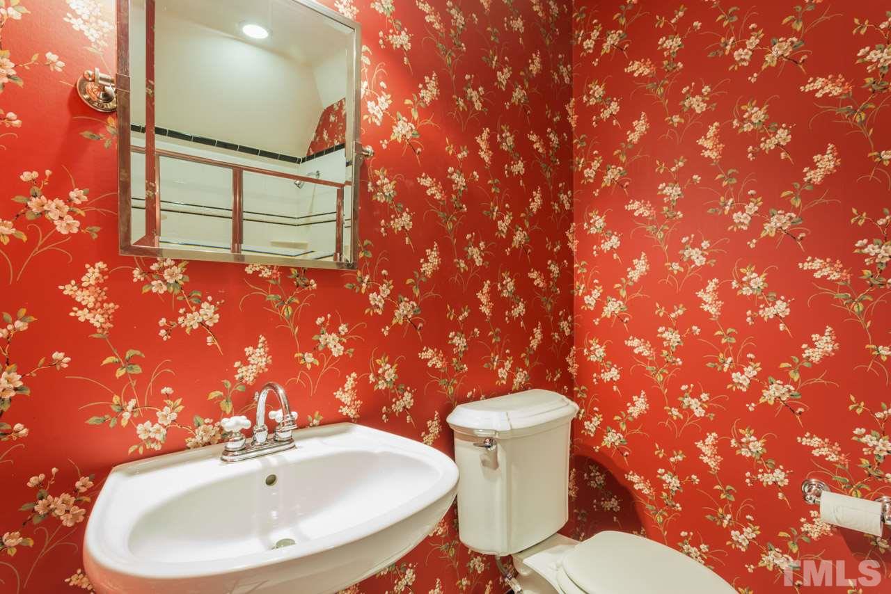 4625 Gamelyn Walk Raleigh, NC 27612 - Photo 17 of 25 a bathroom with a sink mirror and toilet