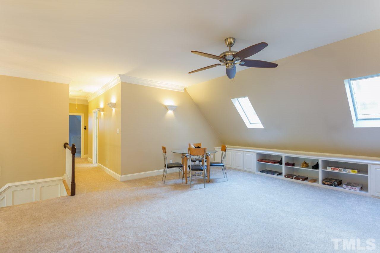 4625 Gamelyn Walk Raleigh, NC 27612 - Photo 19 of 25 a view of a room with gym equipment