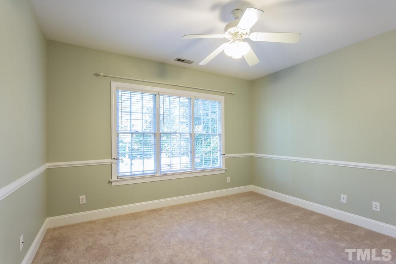 4625 Gamelyn Walk Raleigh, NC 27612 - Photo 20 of 25 an empty room with windows and fan