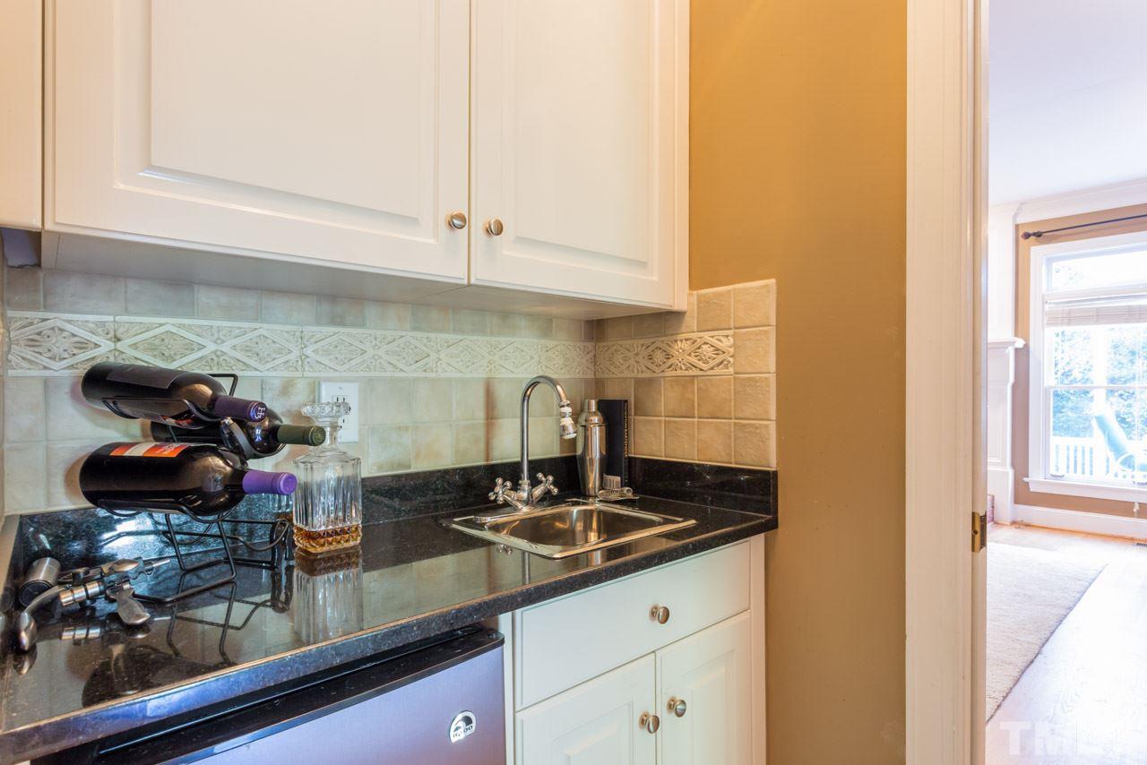 4625 Gamelyn Walk Raleigh, NC 27612 - Photo 5 of 25 a kitchen with a sink and cabinets