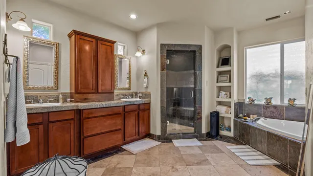a large bathroom with a large tub and sink