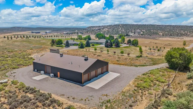 a view of a wooden house with a yard